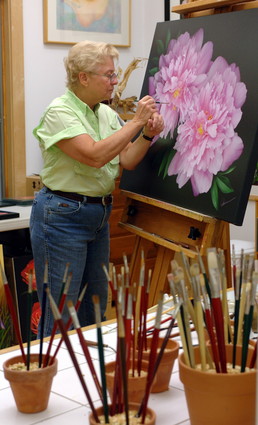 Newsday photo of Mary Ahern painting Botanical Fine Artin her studio