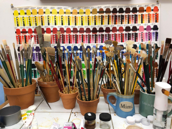 2020 My brushes are stored in clay flower pots with aquarium stone to keep them upright.